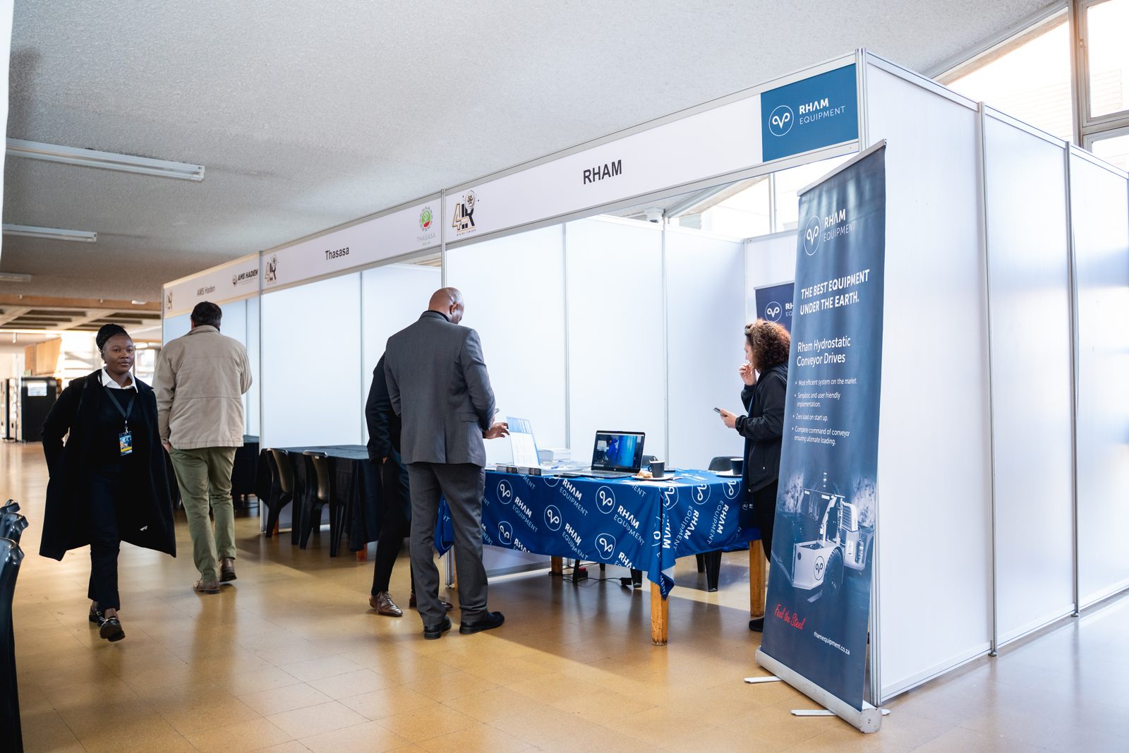 Delegates at a branded equipment supplier stand