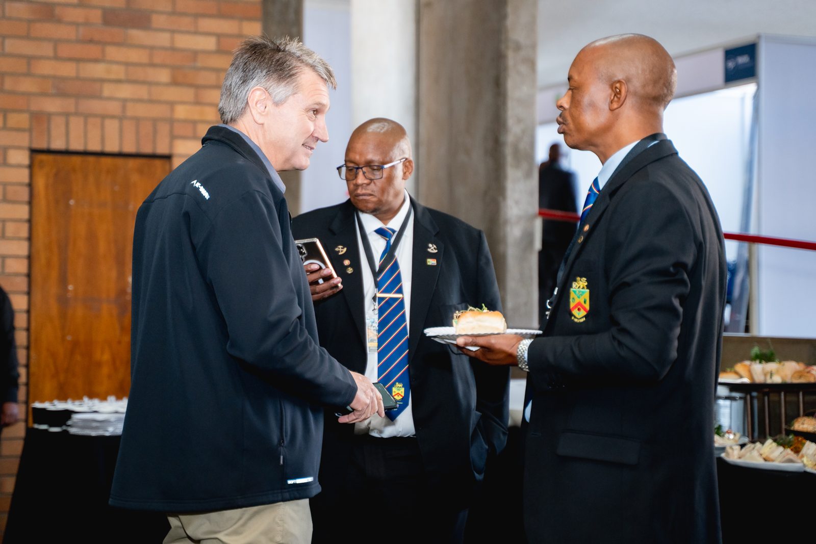 Delegates greeting each other during a networking break