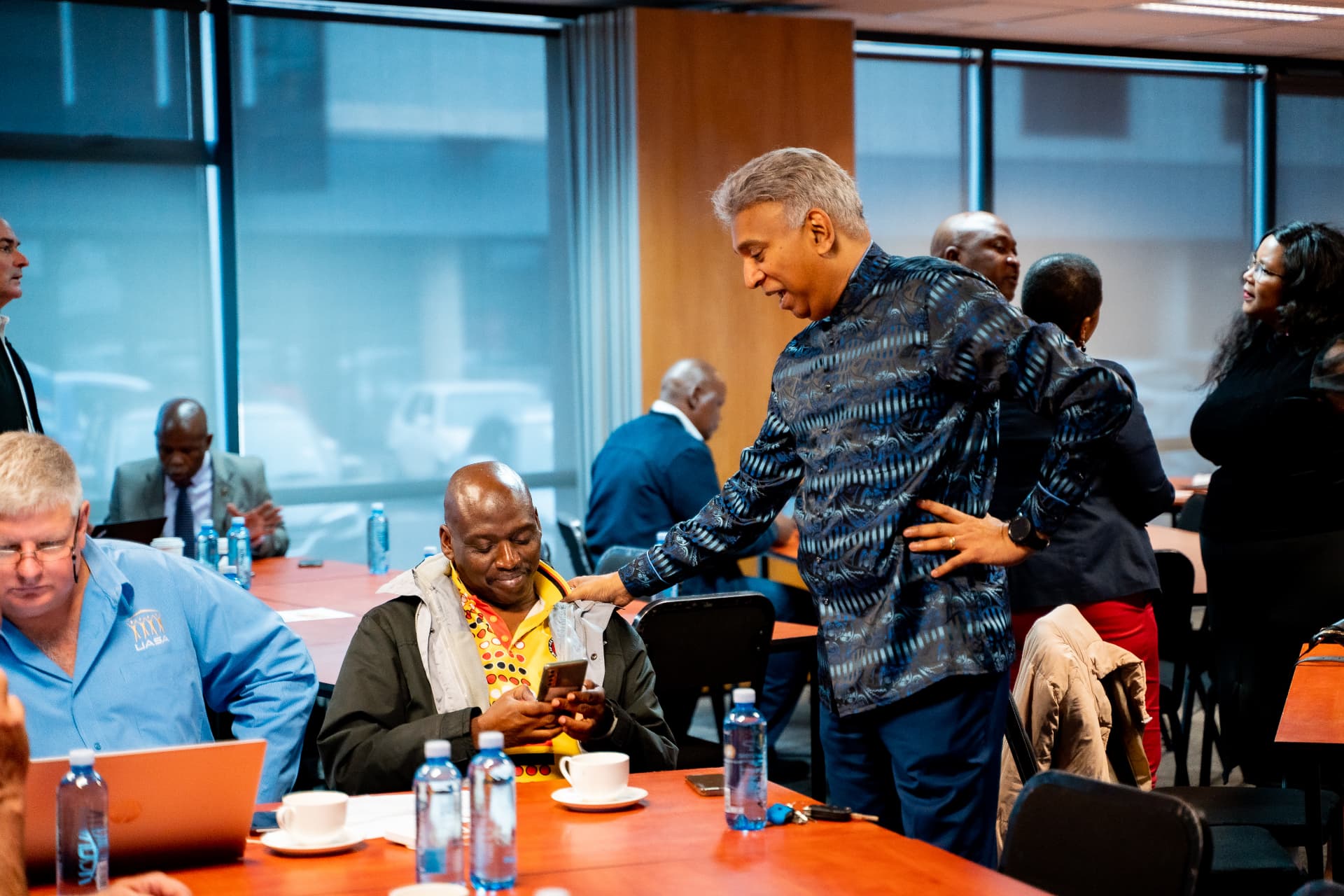 Delegates connecting between sessions at the conference tables