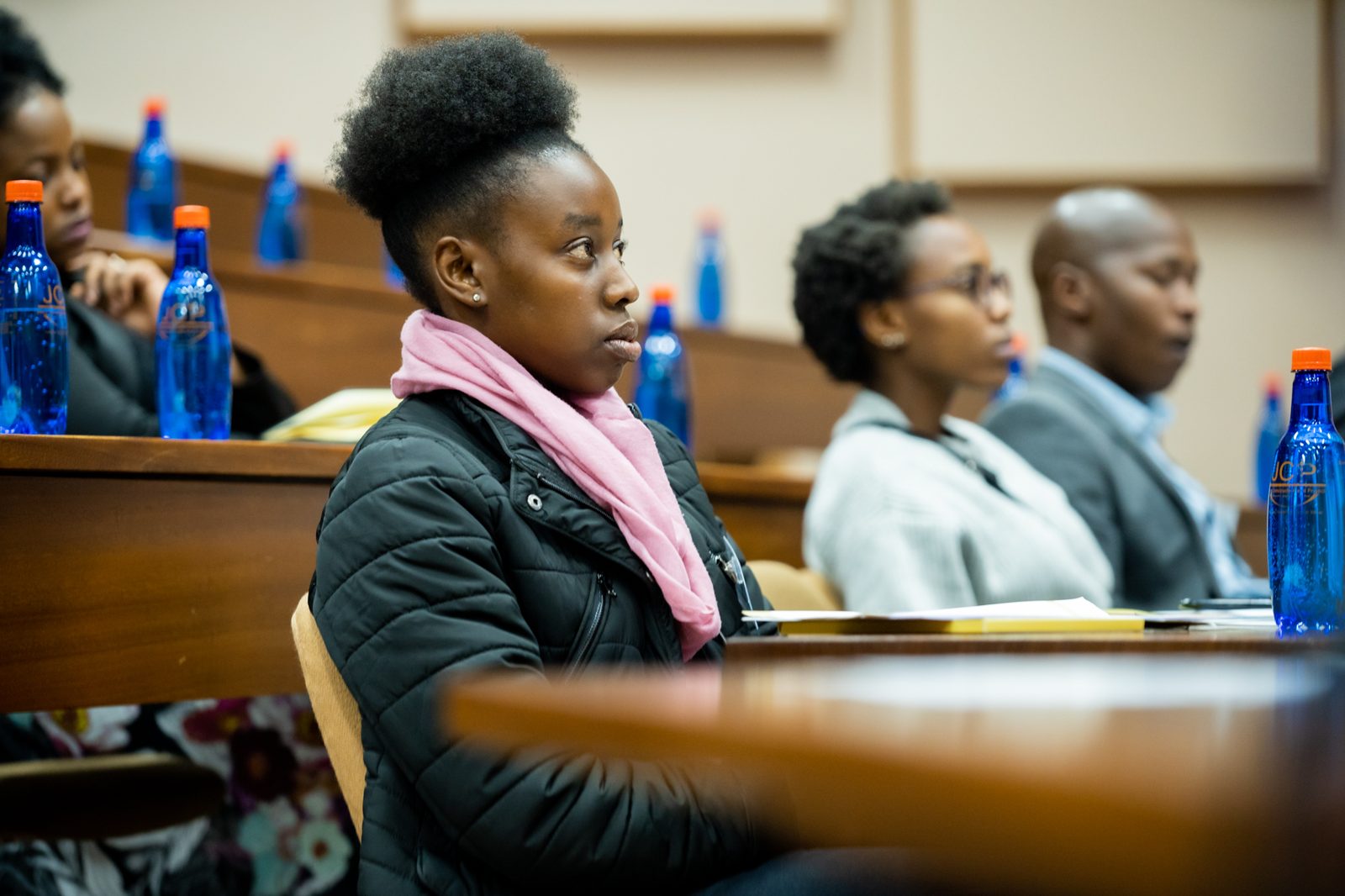 Delegates listening during a session